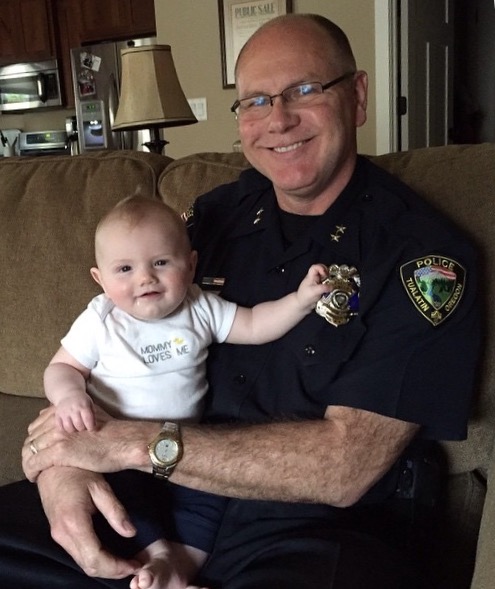 "I wear my badge as a reminder of my responsibility to provide a safe community and to protect the innocent. My grandson reminds me too of that too." - Chief Kent Barker, IACP Vice President at Large