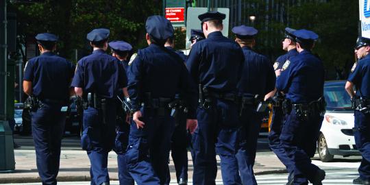 group of police officers crossing the street