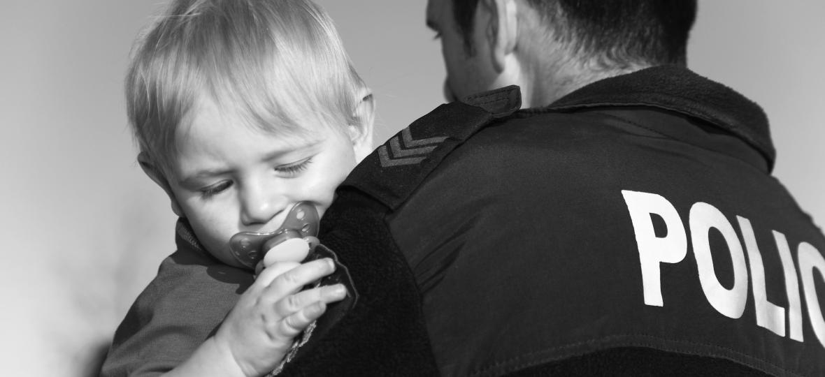 Officer carries toddler