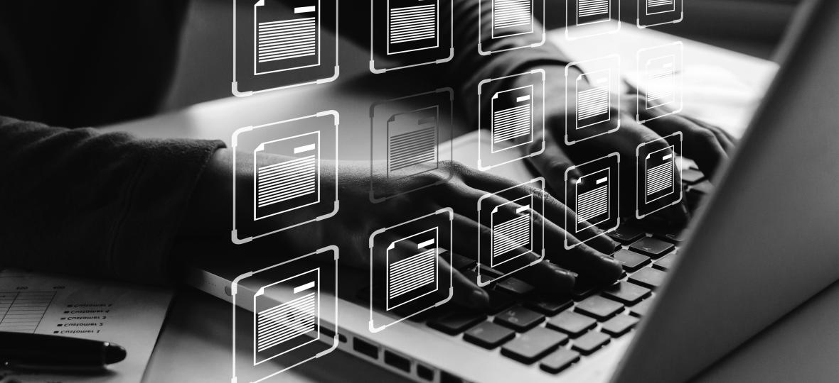 person at computer with file overlays